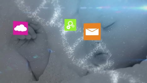 Animation of media icons and baby over dna strand