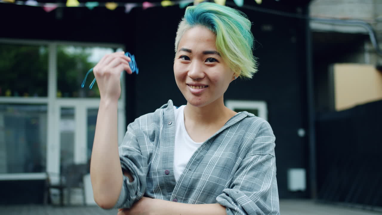 Portrait of a stylish young woman with colorful hair