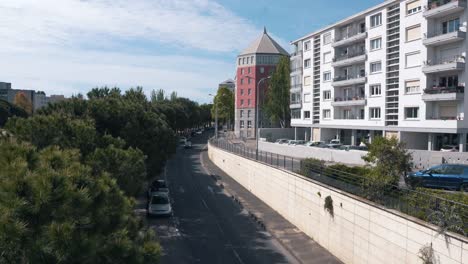 Move-sideways-towards-the-buildings-in-the-morning,-Montpellier---France