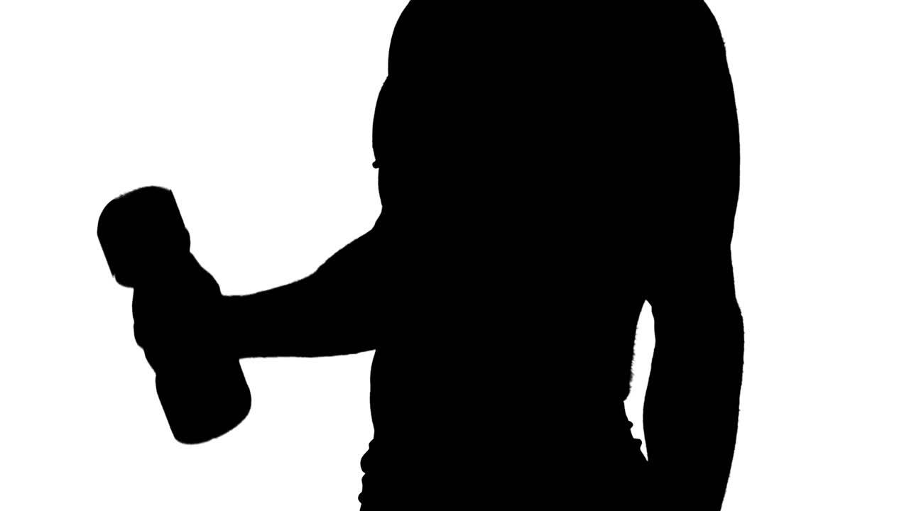 Muscular silhouette of man lifting dumbbels