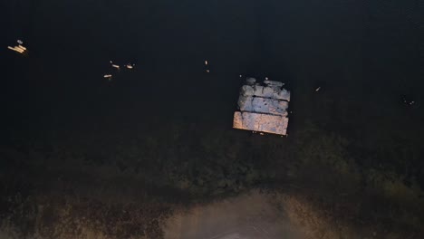 an old cement block anchored offshore in muskegon lake