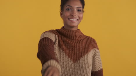 black girl doing victory sign and posing