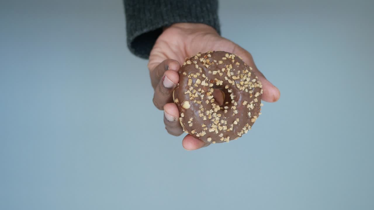 Donut with chocolate and nuts