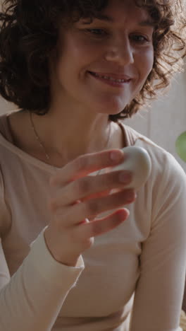 woman holding an egg