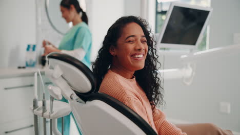 woman smiling in the dentist's chair