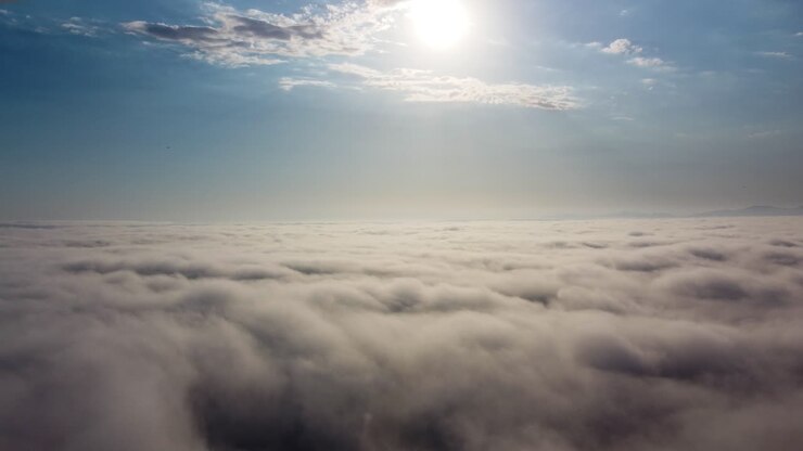 Drone view of a dreamy cloudscape above the horizon line