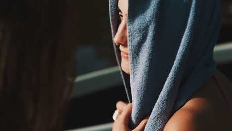 woman drying off after swimming