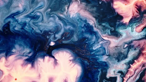 colorful ink swirling and mixing in a fluid pattern, creating abstract forms