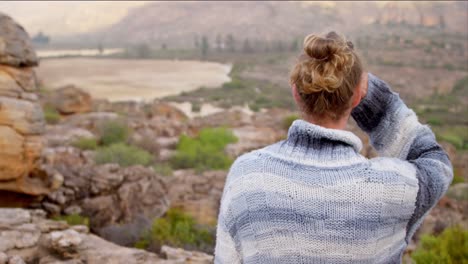 man standing on a mountain top 4k