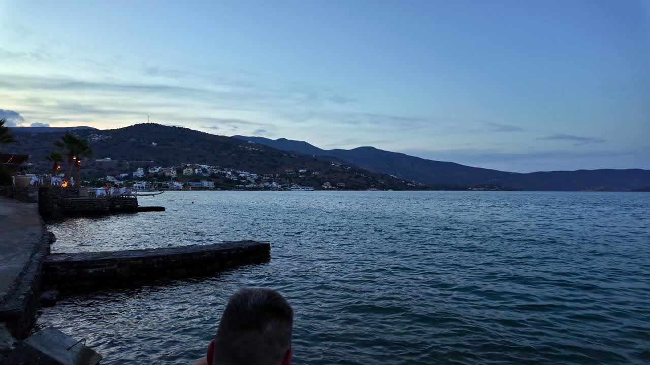 Tourist captures the memories of their vacation at popular destination of Agios Nikolaos