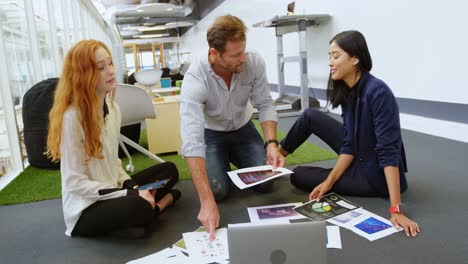 business colleagues discussing over documents 4k