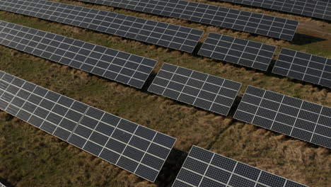 High-angle-footage-of-photovoltaic-cells-in-solar-power-plant.-Green-energy,-ecology-and-carbon-footprint-reduction-concept