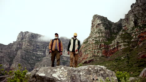 two elderly men hiking in the mountains