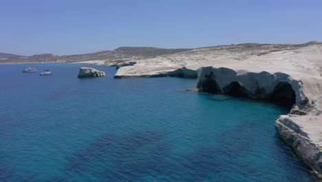 aerial: panoramic view of lunar volcanic sarakiniko beach in milos island, cyclades, greece