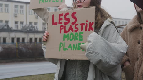 group of young female activists with banners protesting against climate change 2