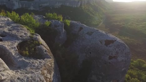 aerial view of mountainous landscape with cliff and valley