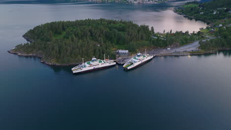 Establishing-shot-of-green-energy-car-ferries-in-mirror-like-archipelago