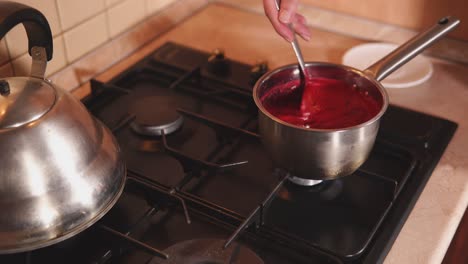 cooking homemade red jam