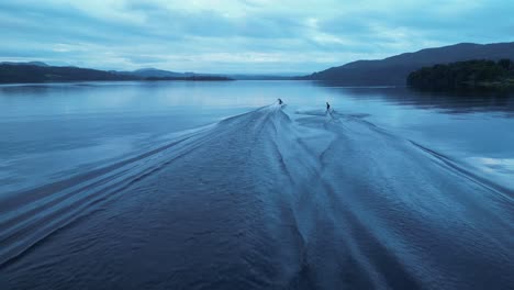 A-kneeboarder-falls-skiing-behind-a-speed-boat