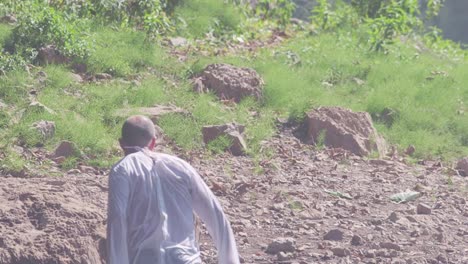 man walking through nature