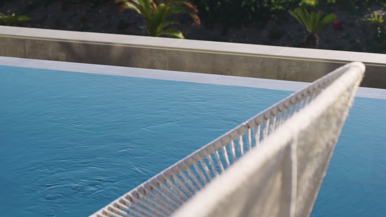 Villa swimming pool with a waven lounge seat next to it in Frontignan, France