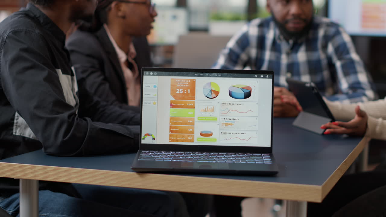 African american team of colleagues meeting in boardroom