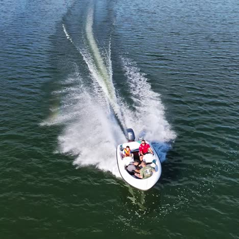 small boat motoring along river