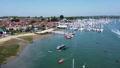 helix drone shot of a large fishing town in the south of england on a sunny day