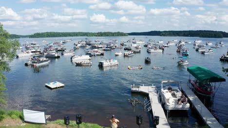 a dynamic ascending aerial footage of a concert held on balsam lake, wisconsin