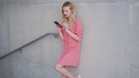 young woman texting on smartphone