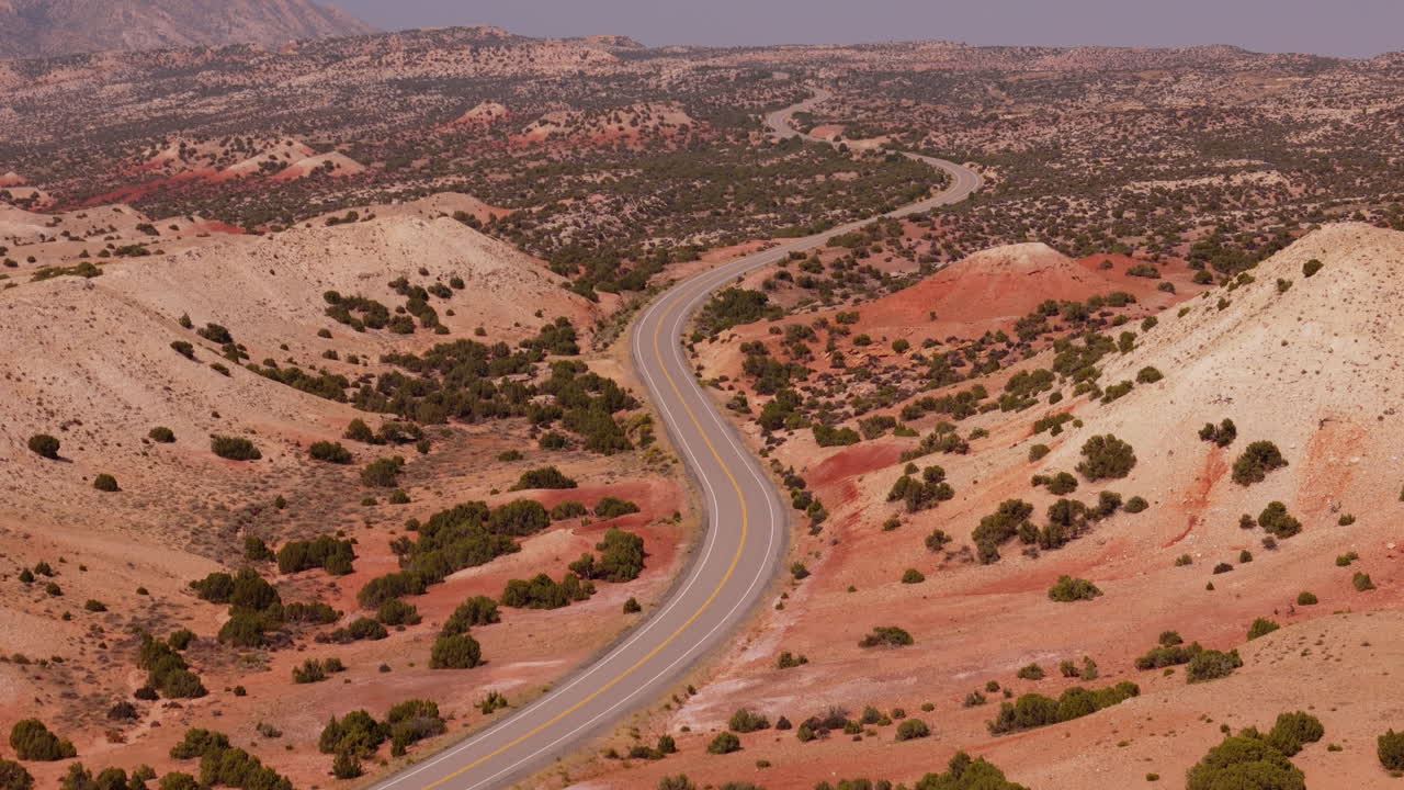 Scenic Winding Road through Red Rock Desert Landscape
