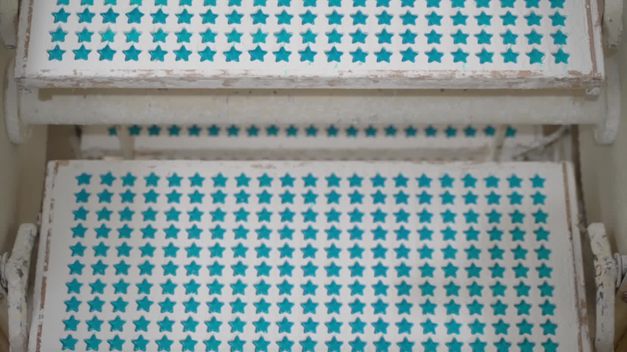 Tray of blue stars, jelly beans, sugar, gums, industrial