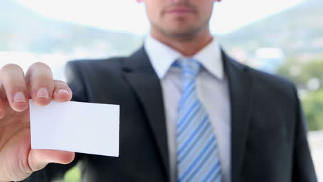 Businessman-showing-his-card