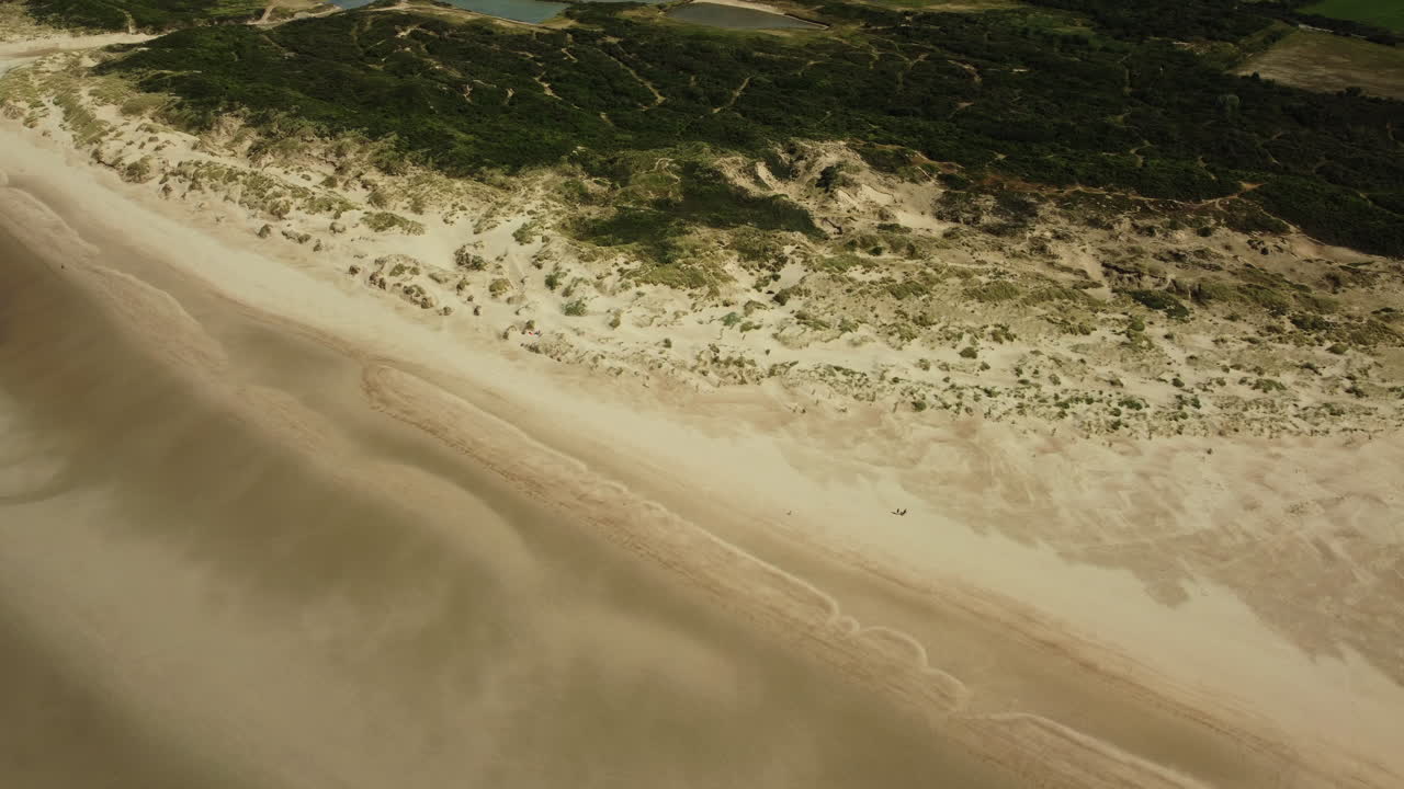Aerial view of a beach with sand dunes