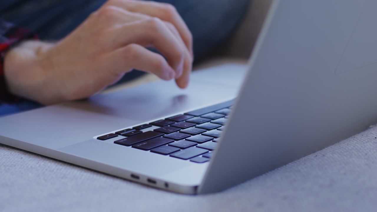Person Typing on Laptop