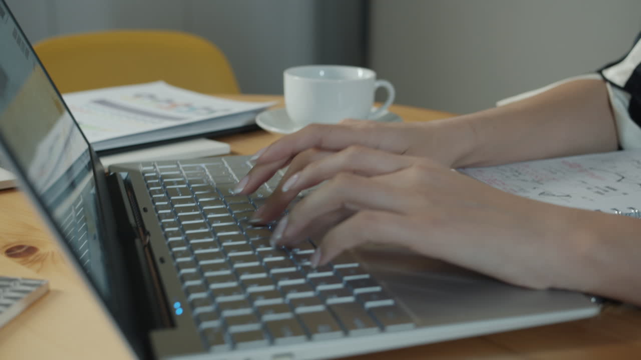 Woman working on laptop at home/office