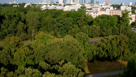 Aerial-of-Warsaw-with-trees-and-building-of-the-city-centre-far-away