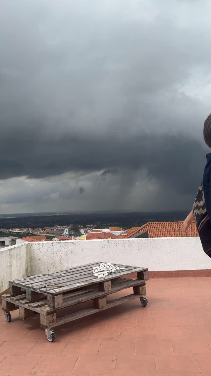 Child on Rooftop During Storm