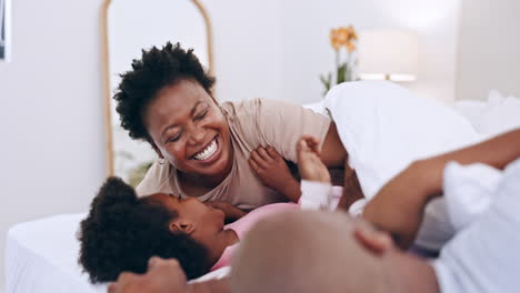 Parents,-children-and-playing-in-bed-with-tickle