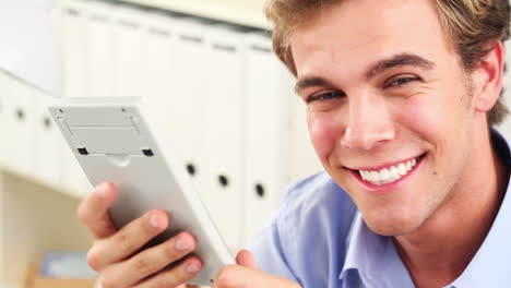 young man using calculator