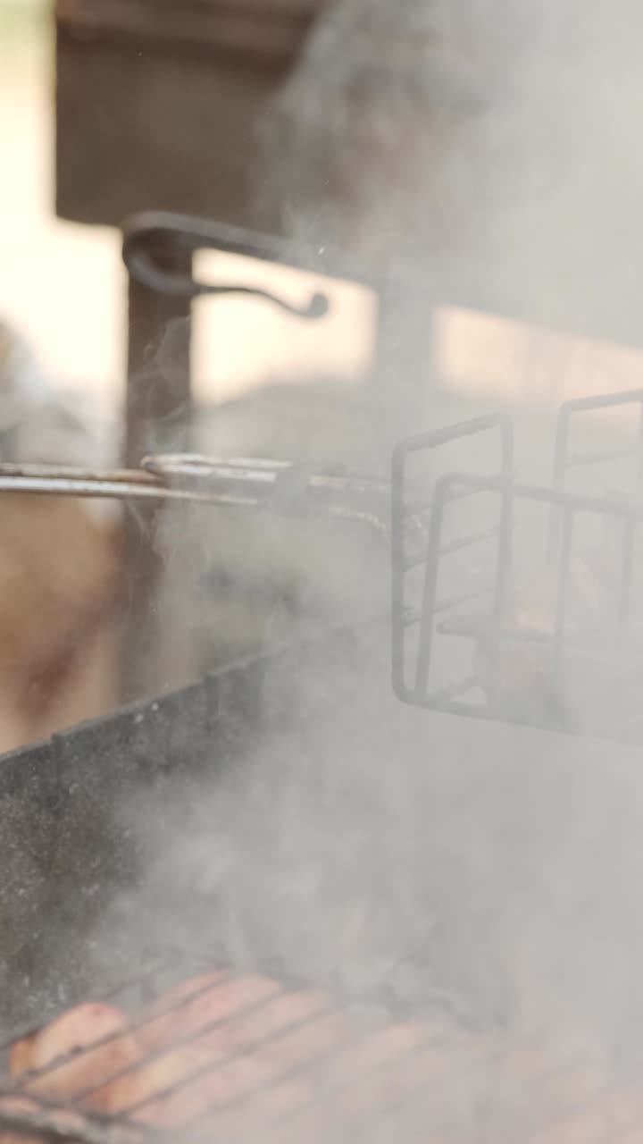 Grilling sausages on a barbecue