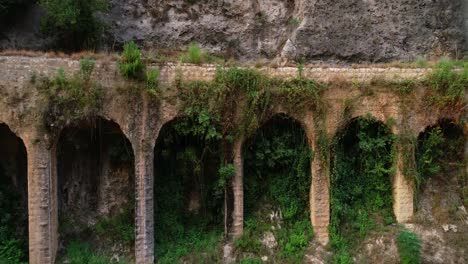 Aerial-drone-view-of-historical-bridge-in-Lebanese-mountains,-forward,-day