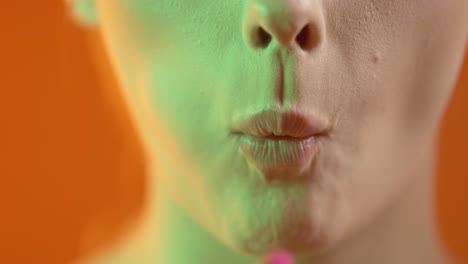 attractive woman eating a marshmallow, mouth close up detail