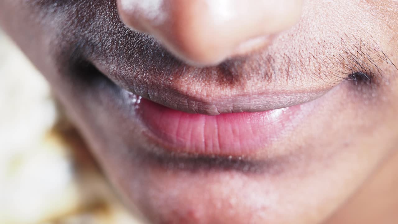 Close-up of a man's face and mouth