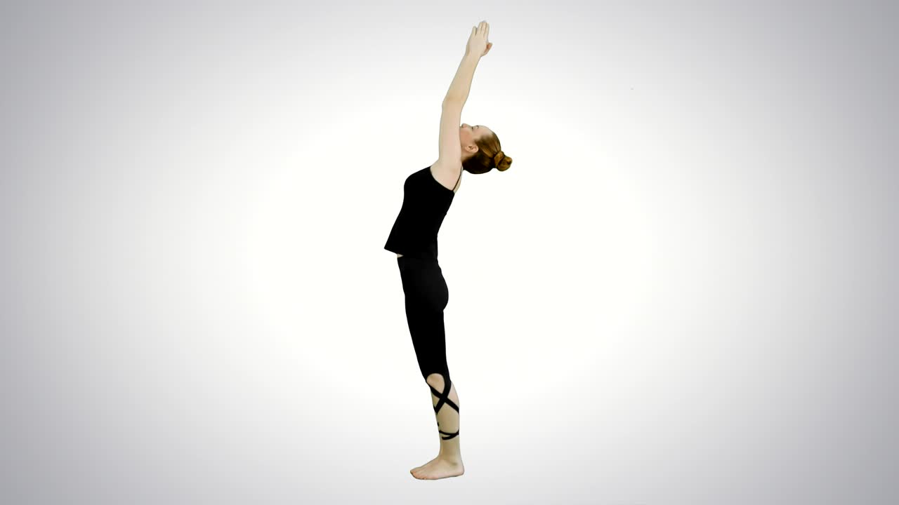 Beautiful woman performing yoga in warrior pose, Virabhadrasana on white background