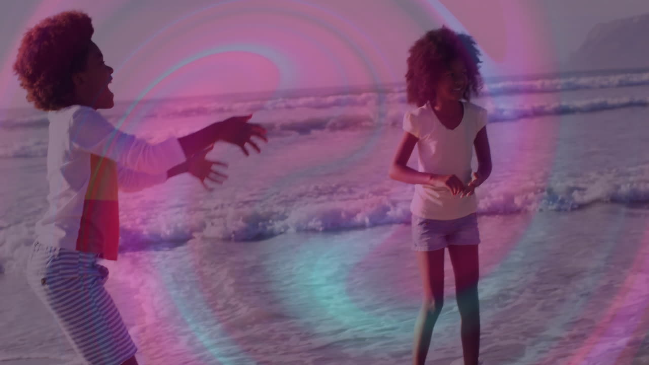 sibling duo tossing beach ball at shoreline, showing animated health icons and wave chart