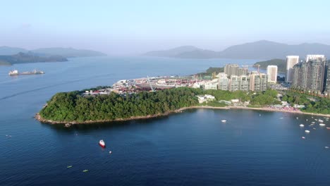 Hong-Kong-Wu-Kai-Sha-beach-and-coastline-with-residential-skyscrapers-in-the-background,-Aerial-view