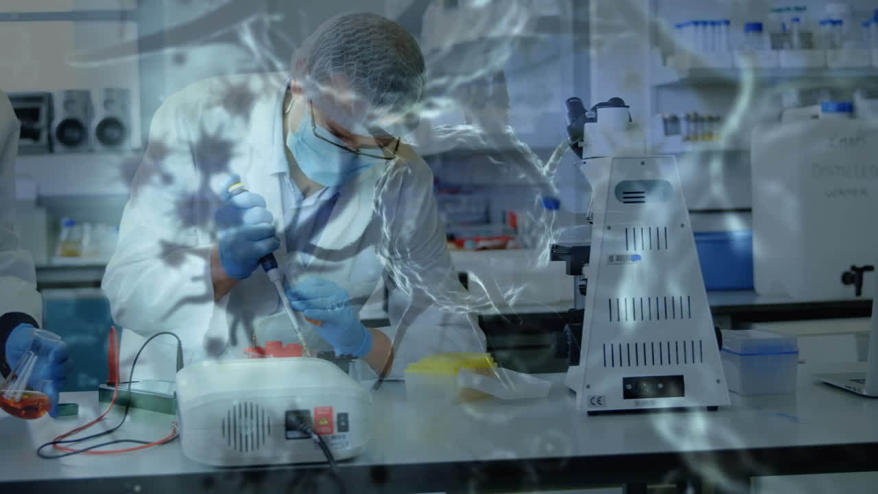 실험실에서 얼굴 마스크를 착용한 사람들에게 코로나바이러스 세포의 애니메이션