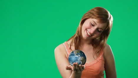 woman holding a globe in her hand