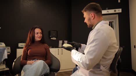 doctor discussing dental model with patient